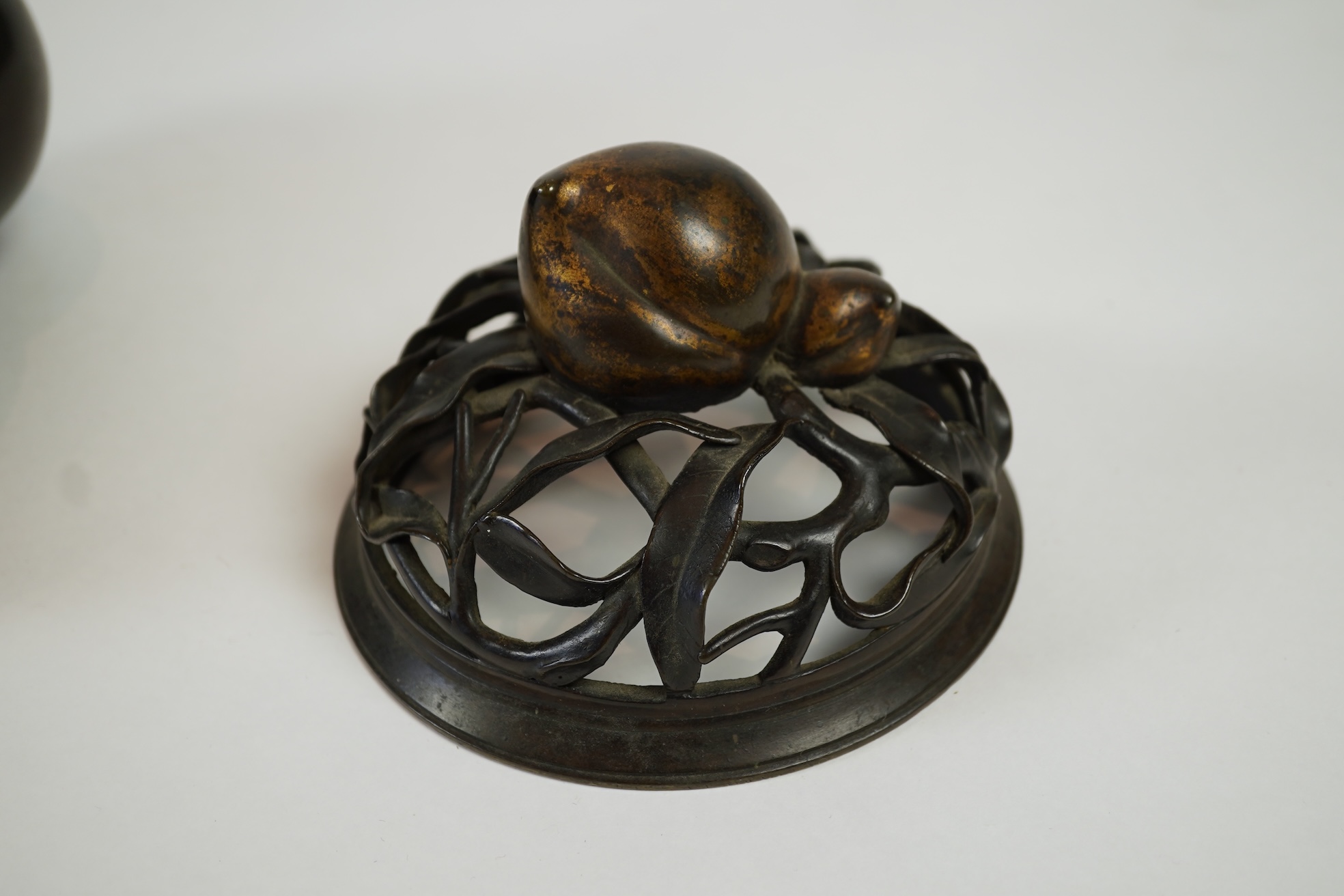 A large Chinese bronze and parcel gilt ‘peach’ censer and cover, Li, 17th/18th century